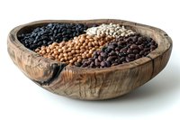Assortment of dried legumes including black, white, brown and red beans in rustic wooden bowl, perfect for healthy cooking and food photography.