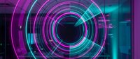 Neon glowing concentric circles with magenta and cyan light rings create a futuristic tunnel effect. Use for tech backgrounds, digital interfaces, gaming visuals, or modern design projects.