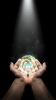 Hands holding glowing crystal ball with swirling light energy against dark background, symbolizing future prediction, spirituality, magic, and mystical power for divination concepts.