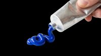 Tube of blue paint pouring out onto transparent background, isolated design element ready for t-shirt graphics, clipart, stickers, sublimation and print-on-demand projects.