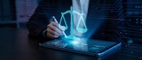 Professional businessman using digital tablet with glowing justice scales hologram for legal technology and law firm applications in modern office.