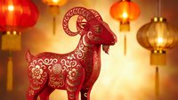 Red paper cut goat with traditional Chinese patterns and lanterns for lunar new year celebration and zodiac festival decoration background.