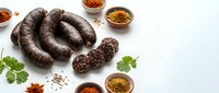 Traditional blood sausage with spices and herbs on white background, perfect for culinary projects and food photography compositions.
