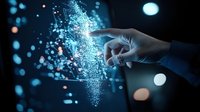 Human hand touching glowing digital particles creating magical light effect against dark background with blue bokeh lights, representing digital transformation.