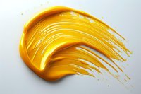Yellow paint smear with dynamic brush strokes and dripping texture on white background, isolated cosmetic product swatch showing fluid motion and glossy finish.