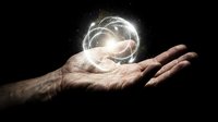 Male hand holding glowing energy sphere with light particles on dark background representing power, magic, innovation and futuristic technology concepts.