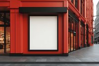Blank white billboard mockup on vibrant red building facade in urban setting, perfect for advertising display in downtown business district.