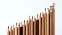 Row of wooden pencils arranged in ascending height order with erasers on white background for educational and office supplies concepts.