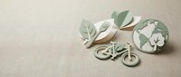 Eco-friendly sustainable lifestyle concept with wooden bicycle, green leaves and natural materials on neutral beige background for environmental design.