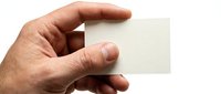 Hand holding blank white business card mockup on transparent background isolated for design and branding presentations.