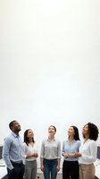 Diverse business team of five professionals laughing and looking up together in modern office space with copy space above for text or graphics.