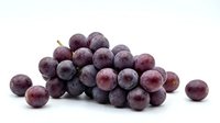 Fresh red grapes cluster isolated on white background for healthy eating and nutrition concepts in food photography and culinary design projects.