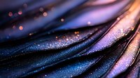 Shimmering dark fabric with iridescent purple and pink highlights creates mesmerizing waves and folds, capturing light in a magical display of texture and color.