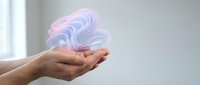 Young adult male hand holding flowing pink and blue liquid or gel substance against neutral background for design projects.