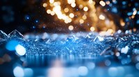 Macro water splash with golden and blue bokeh lights creating magical atmosphere. Crystal clear liquid drops frozen in motion against dark background.