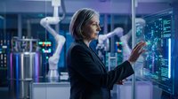 Senior woman in business attire interacting with digital holographic display showing data analytics and code in futuristic tech environment for corporate innovation concepts.