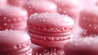 Pink macarons with water droplets on soft blurred background creating dreamy confectionery scene for bakery and dessert marketing materials.