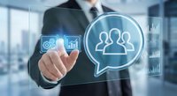 Professional businessman touching digital interface with team management icons and data analytics in modern office environment for corporate communication solutions.