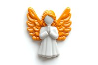 White angel figurine with golden orange wings in prayer pose on transparent background isolated for spiritual and religious design projects.