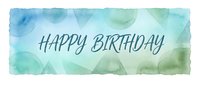 Happy birthday greeting with handwritten script text on soft watercolor wash background in blue and green tones, suitable for cards and celebrations.