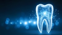 Glowing digital tooth with network connections on blue background for dental technology and healthcare innovation concepts.