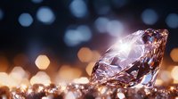 Brilliant diamond with light reflections on blurred bokeh background in warm golden and blue tones, luxury jewelry concept with dramatic lighting effects.