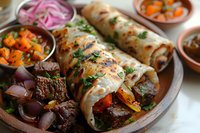 Grilled beef street tacos with pickled vegetables and fresh herbs served on rustic plate. Traditional Mexican cuisine with marinated meat and colorful toppings perfect for menu or recipe design.