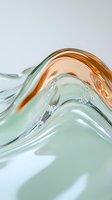 Abstract fluid waves in mint green and copper colors create smooth glossy curves with light reflections and tiny bubbles on minimalist background.