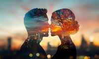 Romantic double exposure silhouette of couple kissing against urban sunset skyline with autumn trees and city lights creating dreamy atmosphere.