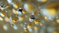 Floating golden and silver spheres with reflective surfaces creating luxury abstract background for premium design projects and modern presentations.