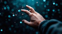 Magical glowing particles floating between fingers against dark background with bokeh lights create mystical atmosphere for fantasy and spiritual concepts.