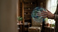 Hands reaching toward glowing magical orb with swirling energy in cozy home interior for fantasy storytelling and supernatural concepts.
