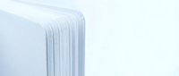 White oil-filled electric radiator heater with vertical fins on clean background for home heating and energy efficiency concepts.
