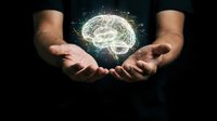 Hands holding glowing brain with neural connections representing artificial intelligence, mental health, psychology, neuroscience and cognitive thinking concepts.