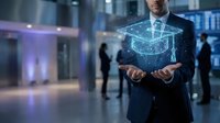 Professional businessman holding holographic graduation cap symbol representing online education technology and digital learning solutions in modern office environment.