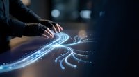 Close-up of hands manipulating glowing blue digital light waves and data streams, representing technology, innovation, and digital transformation in modern computing and network connectivity.