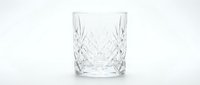 Crystal cut glass tumbler with diamond pattern design isolated on white background for luxury drinkware and barware concepts.