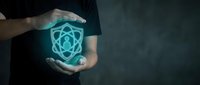 Hands holding glowing atom symbol representing nuclear energy, science research, and atomic technology innovation for educational and corporate use.