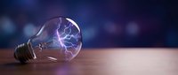 Glowing lightbulb with electric plasma energy inside on wooden surface, symbolizing innovation, creativity, and bright ideas for business and technology concepts.