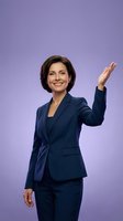 Professional businesswoman in navy blue suit waving hand in greeting gesture on purple background for corporate and business presentations.