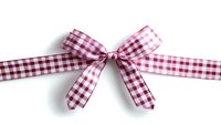 Red and white checkered gingham bow ribbon isolated on white background, decorative element for crafts, gifts and holiday packaging.