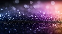 Magical glowing bokeh background with pink and blue gradient colors creating dreamy atmosphere. Defocused glitter particles shine with soft light effect.