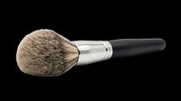 Makeup brush with natural bristles, metal ferrule, and black handle isolated on transparent background. Ready for design use on t-shirts, clipart, stickers, and print-on-demand products.