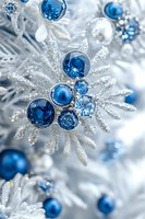 Sparkling silver snowflake ornament decorated with blue crystal baubles and glitter creates elegant winter holiday atmosphere. Perfect for seasonal designs.