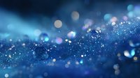 Magical blue glitter background with bokeh effect and sparkling water drops creating dreamy atmosphere. Macro photography of dew with soft focus and blurred lights.