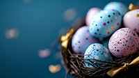 Colorful spotted Easter eggs in pastel pink and blue tones with gold speckles nestled in dark decorative nest against teal background with bokeh lights.
