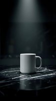 White ceramic mug on black marble surface with dramatic studio lighting, isolated on dark background for mockup and branding designs.