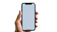 Female hand holding modern black smartphone with blank screen mockup isolated on white background. Ready for app or web design presentation.