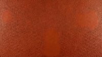 Close-up of terracotta leather texture with fine grain detail, suitable for backgrounds, design projects, and material references.