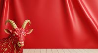 Red goat with golden horns and details standing against luxurious red silk fabric backdrop with wooden floor for festive holiday and luxury design projects.